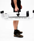 Carrying the folded Bike Balance Trainer And Repair Stand Combo for Cyclists Build Core Stability Quick Reaction Time And Full Body Strength