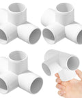 Four Pack One And A Half Inch PVC Elbow Fittings Four Way Cross Heavy Duty Furniture Grade Pipe Connector Corner Fittings shown in hand.