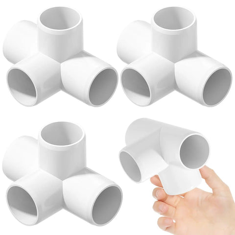 Four Pack One And A Half Inch PVC Elbow Fittings Four Way Cross Heavy Duty Furniture Grade Pipe Connector Corner Fittings shown in hand.