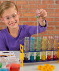 Child using Large Plastic Test Tube Rack For Classroom Use with colorful samples, ideal for science experiments in schools and labs