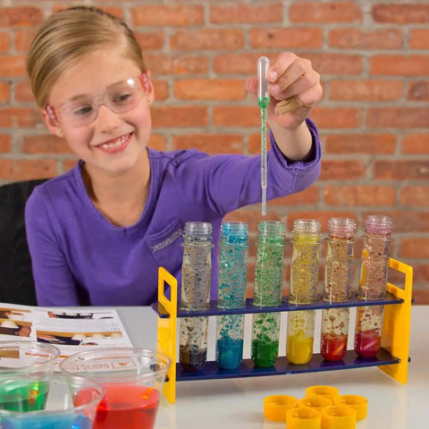 Child using Large Plastic Test Tube Rack For Classroom Use with colorful samples, ideal for science experiments in schools and labs
