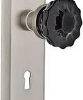 New York Plate With Keyhole Passage Crystal Black Glass Door Knob In Satin Nickel Finish With A Retro Vibe Two And Three Quarters Inch Backset