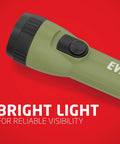 Close-up of green flashlight from 8 Pack LED Flashlights With Batteries Included, Beast Bright Handheld Flashlights For Camping, Road Trips, Car Emergencies, Power Outages, 30 Hour Runtime, Built Tough For Everyday Use on red background.