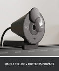 Full HD 1080P Business Webcam With Wide Angle Lens And Sliding Privacy Shutter Zoom Microsoft Teams Certified mounted on a monitor.