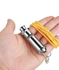 Hand holding Stainless Steel Ultrasonic Pigeon Whistle With Lanyard For Bird Training And Pet Behavior Improvement Durable Tool