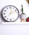 Wall clock with Metal Clock Hands Replacement Kit 10 Sets Handy DIY Wall Clock Hands, gold hands on shelf with plants.