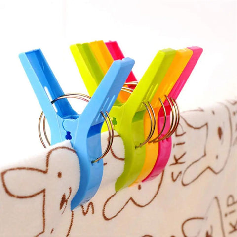 Heavy Duty Beach Towel Clips for Chairs and Loungers securely holding towels with colorful, windproof design.