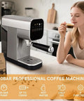 Compact Touchscreen Espresso Machine With Integrated Steam Milk Frother And Programmable Cup Sizing on kitchen counter with a user enjoying coffee.