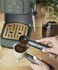 Rock Solid Compact Espresso Machine In Fresh Thyme Green with portafilter and freshly ground coffee on countertop.