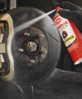 CRC Brakleen brake cleaner spray can aimed at a car brake rotor and bronze brake caliper (29 oz Pro Series)