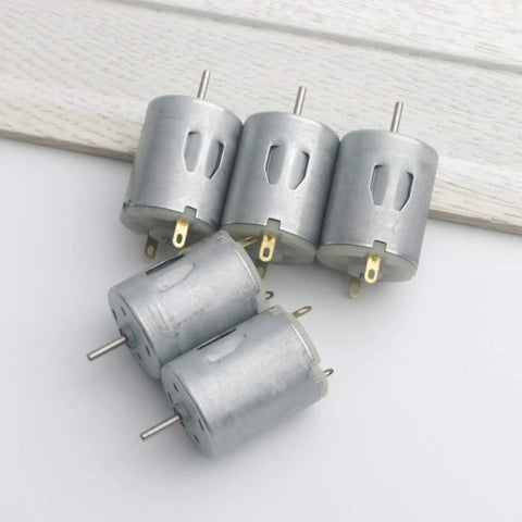 Pack of 5 micro DC motors for RC boats and DIY projects, 3V to 12V operation, 42mm by 24mm body, 2mm shaft, top view on white