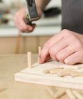 Inserting dowel pins into wood for woodworking; Dowel Pins One Quarter Inch By One And A Half Inch Fluted Hardwood Pegs For Woodworking And Model Building 100 Pack Pro Grade DIY Ready Heavy Duty For Strong Joints And Superior Glue Adhesion.