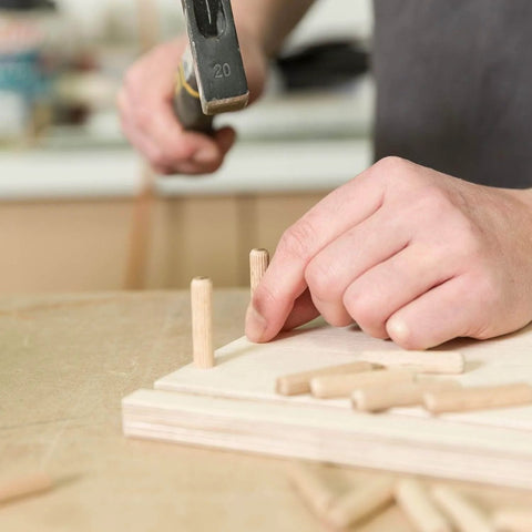 Inserting dowel pins into wood for woodworking; Dowel Pins One Quarter Inch By One And A Half Inch Fluted Hardwood Pegs For Woodworking And Model Building 100 Pack Pro Grade DIY Ready Heavy Duty For Strong Joints And Superior Glue Adhesion.