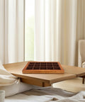Top Shelf Solid Walnut Wood Jewelry Tray Organizer With Fifteen Grids For Rings Necklaces And Bracelets Compact Vanity Storage Display Plate For Counters on a wooden table.