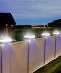 Fence illuminated by 4x4 Solar Post Cap Light No Hassle Easy Install With 52 LEDs, 160 Lumen Outdoor Deck Lights For 3.5x3.5 Posts