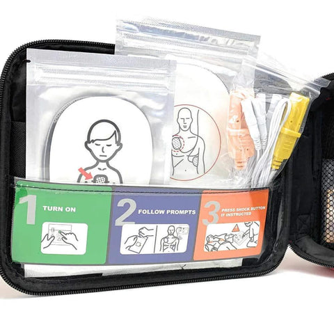 AED training kit in a black zip case with defibrillator practice pads and 200 Practi-Shield CPR shields.
