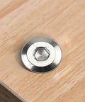 Rock Solid 12 Set M6 Hex Socket Head Cap Screws With Barrel Nuts And 4 Mm Hex Key 304 Stainless Steel showing a hex socket screw on wood.
