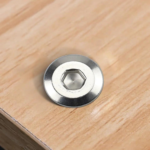 Rock Solid 12 Set M6 Hex Socket Head Cap Screws With Barrel Nuts And 4 Mm Hex Key 304 Stainless Steel showing a hex socket screw on wood.