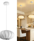11.5in Small Lantern Pendant Light, White Imitation Silk Bubble lamp hanging in a modern kitchen with soft glow.