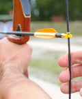Forty Piece Archery Nock Points Set For Bow String Nocking Point Clips Fits Compound And Recurve Bows in use outdoors