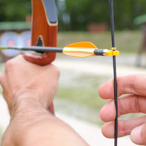 Forty Piece Archery Nock Points Set For Bow String Nocking Point Clips Fits Compound And Recurve Bows in use outdoors