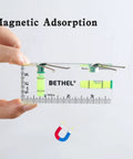Nifty Tiny Handheld Magnetic Bubble Spirit Level With Clear Acrylic Measure Stick For Sweet Quick Picture Hanging Alignment On All Your Weekend Diy And Barn Repairs held in hand with magnetic features.