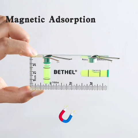 Nifty Tiny Handheld Magnetic Bubble Spirit Level With Clear Acrylic Measure Stick For Sweet Quick Picture Hanging Alignment On All Your Weekend Diy And Barn Repairs held in hand with magnetic features.