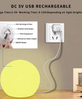 LED Glowing Ball Light Cordless 8 Inch With 16 Color Changing Options And 4 Light Modes touching base near USB outlet