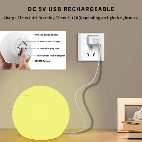LED Glowing Ball Light Cordless 8 Inch With 16 Color Changing Options And 4 Light Modes touching base near USB outlet