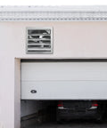 Powerhouse 16 Inch Shutter Exhaust Fan With AC Motor Delivers 2000 CFM installed on garage wall for ventilation