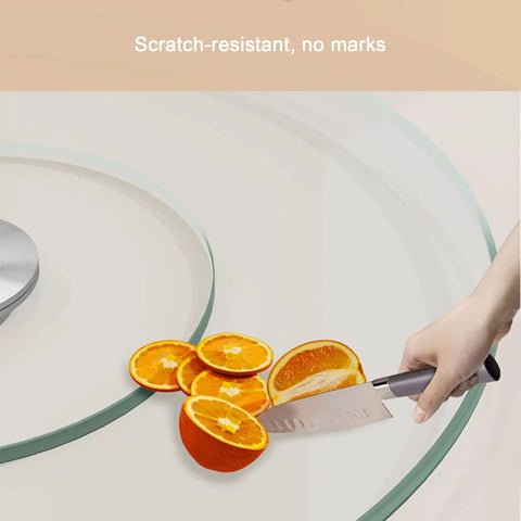 Hand slicing oranges on a round tempered glass spin turntable for dining tables with durable aluminum bearing perfect for shareable appetizers.