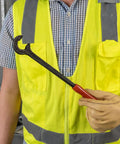 Worker holding a Heavy-Duty 12-Inch Cable Bender For 350 MCM Capacity Pro Grade Tool with Contoured Grip, one-piece forged steel.