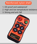 Front view: Q400 industrial wireless crane remote control in orange with four black buttons and a green Start button.