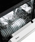 Low Maintenance Front Control Dishwasher Featuring A Hybrid Stainless Tub And Smart Auto Cycle For No Sweat Daily Cleans and Heavy Duty Batch Scraping With Quiet Operation showcasing clean plates, glasses, and utensils in the top and bottom racks.
