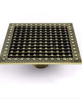 Heavy Duty Copper Floor Drain With Removable Debris Filter For Bathrooms Walk In Showers And Vintage Tubs large square design with intricate pattern.