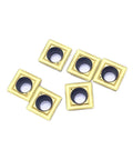 Premium 10Pc Indexable Carbide Lathe Tool Set With SPMG060204 Inserts close-up of six gold and black carbide inserts for CNC machining.