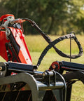 72 Inch Manure Tine Grapple Bucket Attachment With SSQA Hay Spear Frame And Double Grapple Rake Arms For Heavy Duty Clamping Power And 3000 PSI Twin Cylinders Do It All On The Farm shown in close-up with hydraulic components and outdoor setting