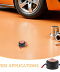 Two Pack Self Activating Fire Extinguisher Stickers No Sweat Auto Fire Defense on garage floor next to car tools.