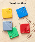 Five colorful automatic needle threaders for hand sewing and sewing machines, displayed on a wooden surface with size dimensions.
