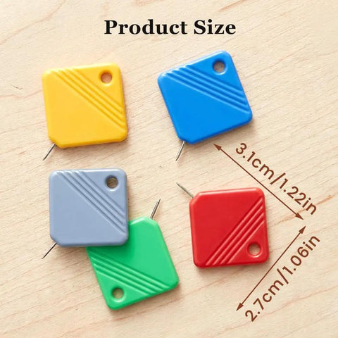 Five colorful automatic needle threaders for hand sewing and sewing machines, displayed on a wooden surface with size dimensions.