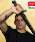 Man holding Tough As Nails Polypropylene Training Dagger For Combat Practice With Textured Grip 18.5 Inch Overall Length