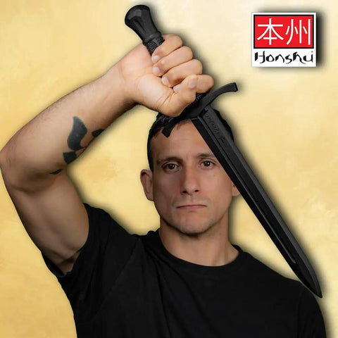 Man holding Tough As Nails Polypropylene Training Dagger For Combat Practice With Textured Grip 18.5 Inch Overall Length