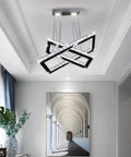 Lit LED Two Ring Rectangular Crystal Chandelier Pendant Light in stainless steel, hanging from ceiling in modern living room