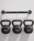 Built Tough Sixteen Inch Oil Rubbed Bronze Shower Grab Bar Wall Mounted Rustproof Stainless Steel Bathroom Safety Rail With Heavy Duty Grip And Killer Anti Slip Finish showcasing kettlebells hanging on a bar.