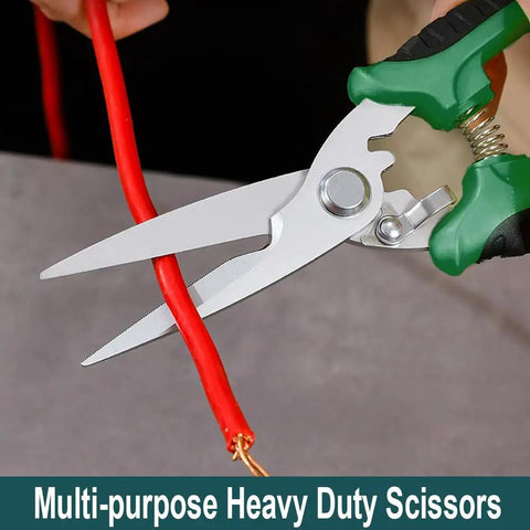 Tough As Nails Heavy Duty Tin Snips And Industrial Scissors With Serrated Stainless Blade cutting red wire cable.