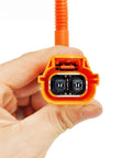 Rugged Electric AC Compressor Compatible With Byd Qin EV Cooling Pump BC28A 409V connector held in hand, orange casing and pins visible.
