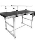 Heavy Duty Workhorse Electric Conveyor Belt With Hassle Free Adjustable Speed And Anti Static PvC Track Rolling Smooth On A Beefy Stainless Steel Base For Worry Free Daily Shipping Grind, featuring a large black tracking surface.