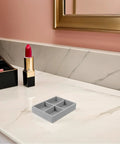Slick Mini Velvet Jewelry Organizer Tray With Four Separate Dividers For Bracelets And Watches on a marble countertop.
