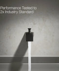 6 Inch Wall Mount Diverter Bath Spout With Half-Inch Slip-Fit Connection Matte Black Finish flowing water against wall