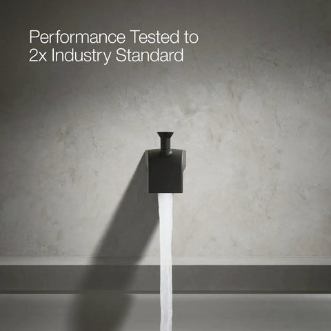 6 Inch Wall Mount Diverter Bath Spout With Half-Inch Slip-Fit Connection Matte Black Finish flowing water against wall